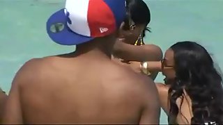 Bare-breasted dark-hued queen unsheathes her infatuating big breasts at the beach