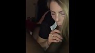 She's got a huge monster cock in her mouth and she's sucking it
