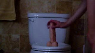 Wife rides her fat toy on the toliet
